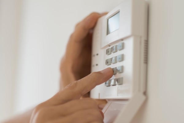 Hand setting code on burglar alarm.