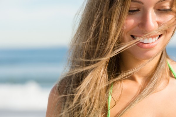 Beautiful woman at beach. Photo : Jamie Grill