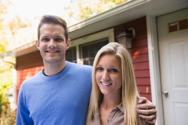 Couple in front of cottage. Photo: Jamie Grill