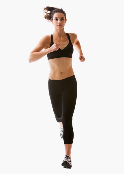 Young woman running, studio shot. Photo : Mike Kemp