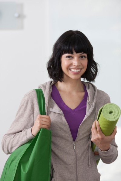 Portrait of young woman going for fitness. Photo : Dan Bannister