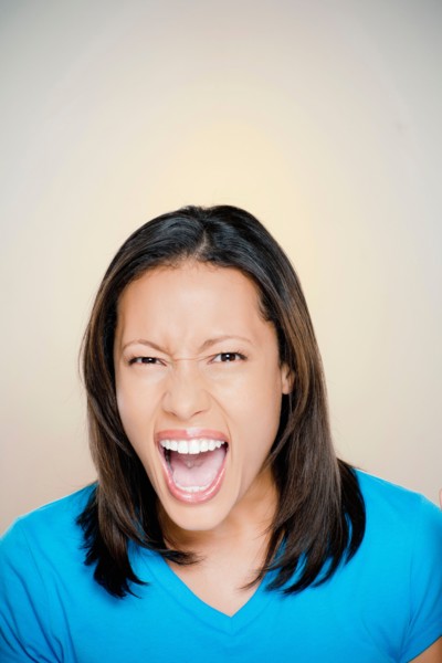 Portrait of woman screaming. Photo : Rob Lewine