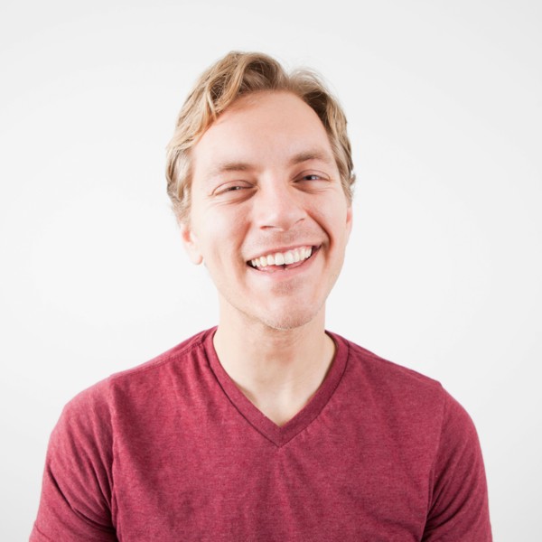 Studio Shot of mid adult man expressing happiness. Photo: Jessica Peterson
