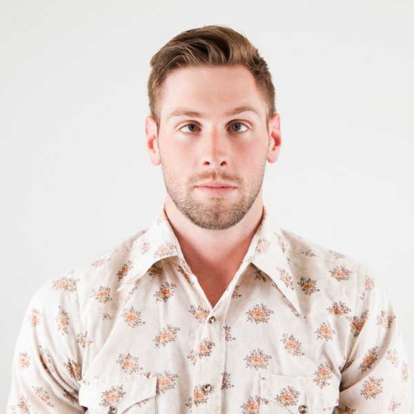 Studio portrait of cross-eyed man. Photo: Jessica Peterson