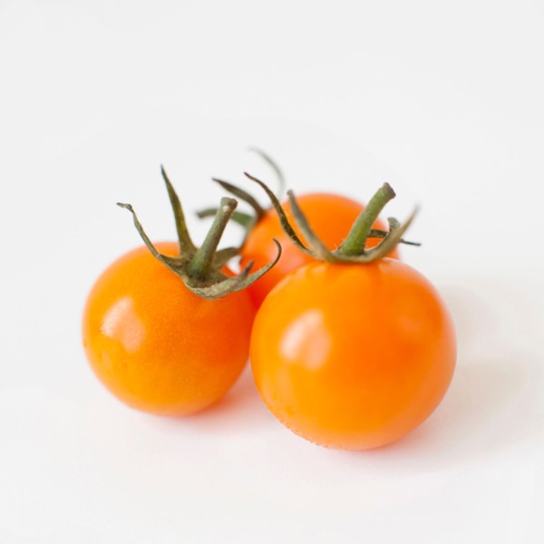 Studio Shot of three Cherry Tomatoes. Photo: Jessica Peterson
