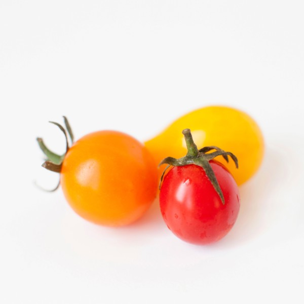 Studio Shot of three Cherry Tomatoes. Photo: Jessica Peterson