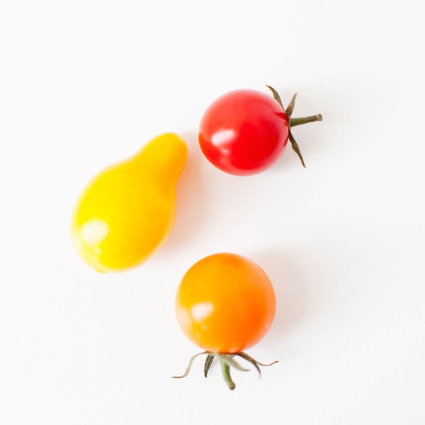 Studio Shot of three Cherry Tomatoes. Photo: Jessica Peterson