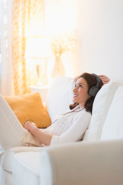 Woman listening to music at home.