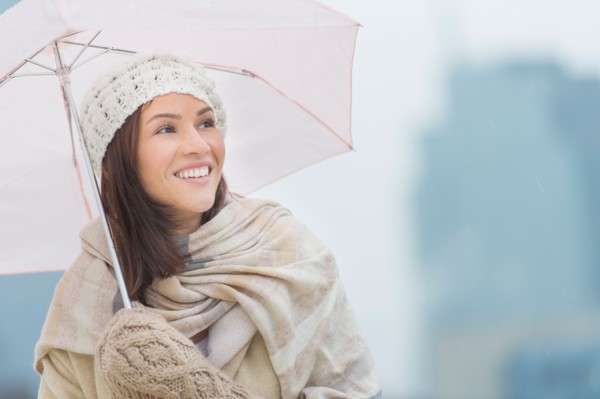 Portrait of woman with umbrella.