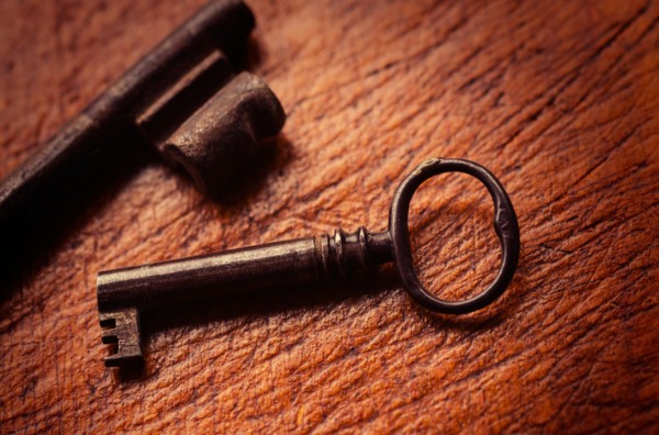 Antique keys on wood.
