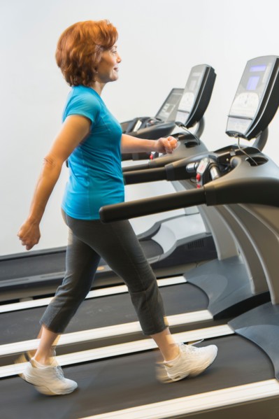Senior woman on treadmill.