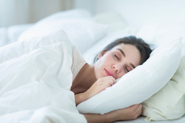 Woman sleeping in bed.