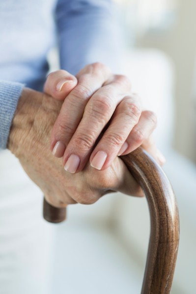 Close-up of hands of grandmother and granddaughter (16-17).