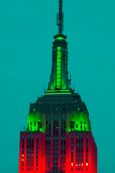 Empire State Building illuminated in red and green.