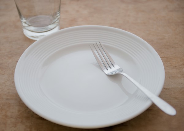White plate with fork and glass