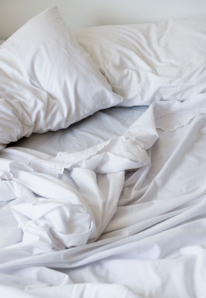 White bedclothing in mess