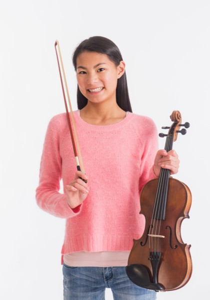 Portrait of teenage girl ( 16-17 years) holding violin