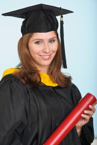 Portrait of graduate student holding diploma