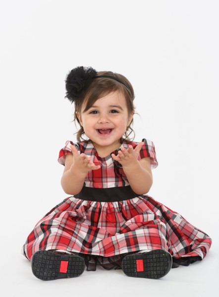 Portrait of Baby girl ( 6-11 months) wearing plaid dress