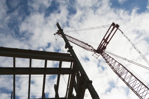 Upward view of crane and construction