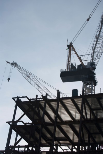 Low angle view of crane and building under construction