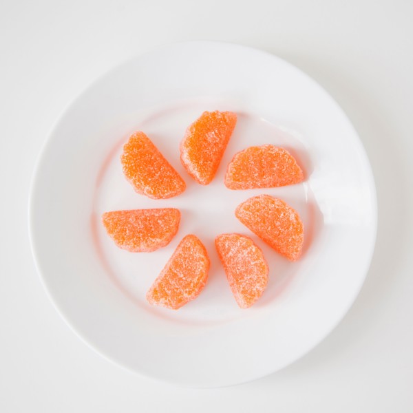 Studio Shot of candies imitating orange