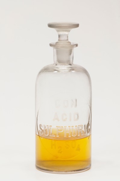 Laboratory flask containing yellow liquid