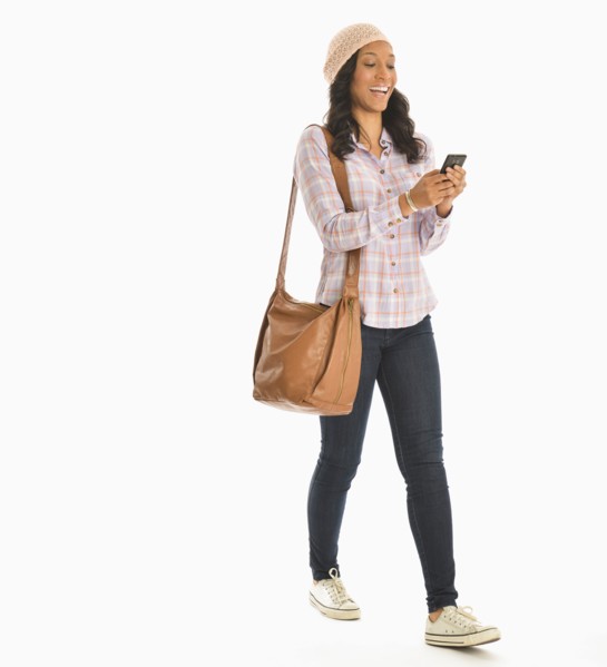 Mid adult woman using phone.