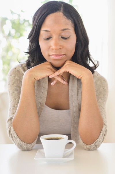 Woman drinking coffee.