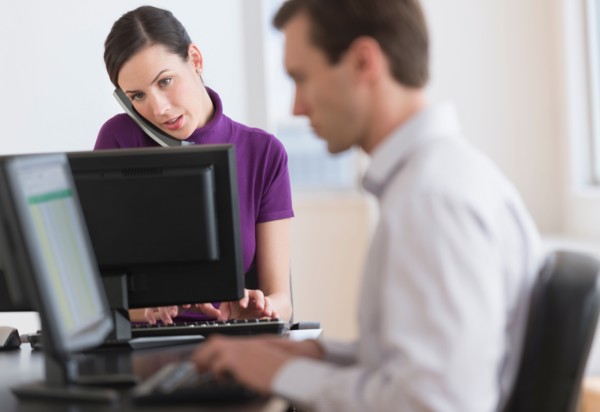 Office workers using computers.