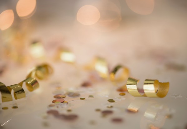 Close-up of gold streamer and confetti