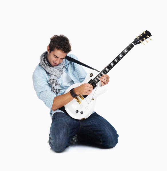 Studio shot of man playing electric guitar