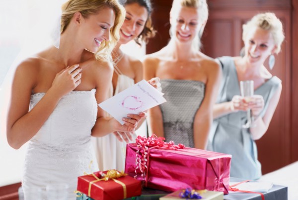 Bride  and bridesmaids unpacking gifts