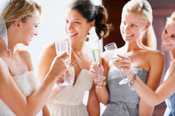 Bride and bridesmaids toasting