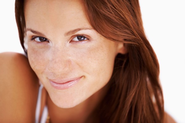 Studio portrait of woman smiling