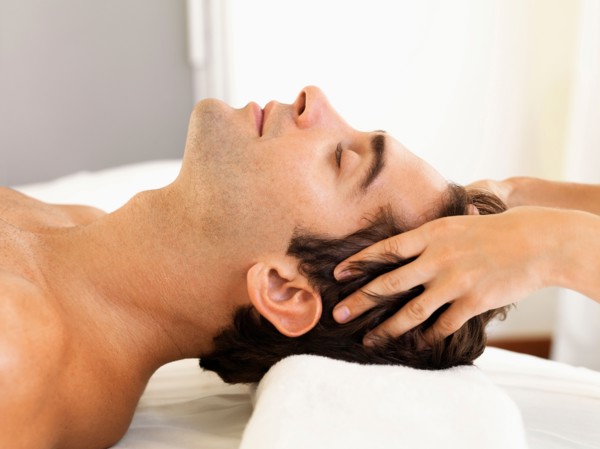 Man receiving massage in spa
