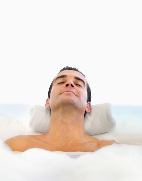 Man relaxing in bathtub