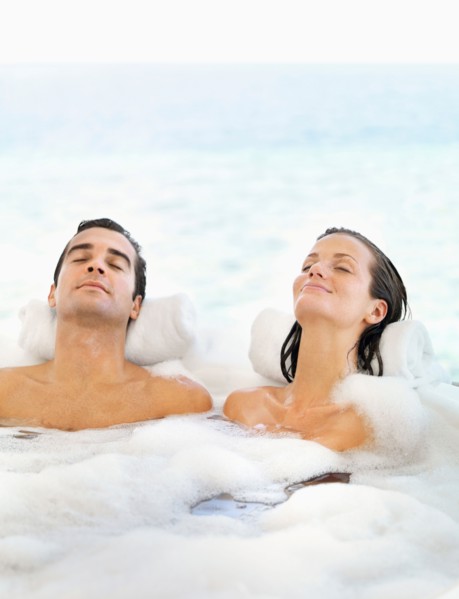 Couple relaxing in bathtub