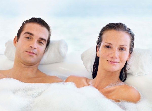 Couple relaxing in bathtub