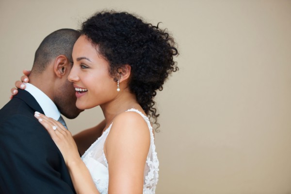 Bride and groom embracing