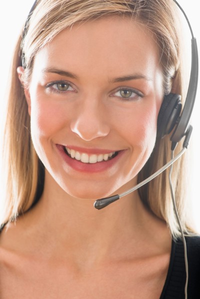 Studio portrait of young woman wearing headset.