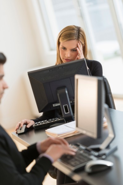 Business man and woman working in office.