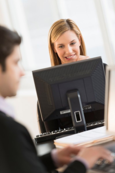 Business man and woman working in office.