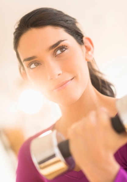 Woman lifting dumbbell.