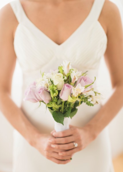 Bride holding bouquet.