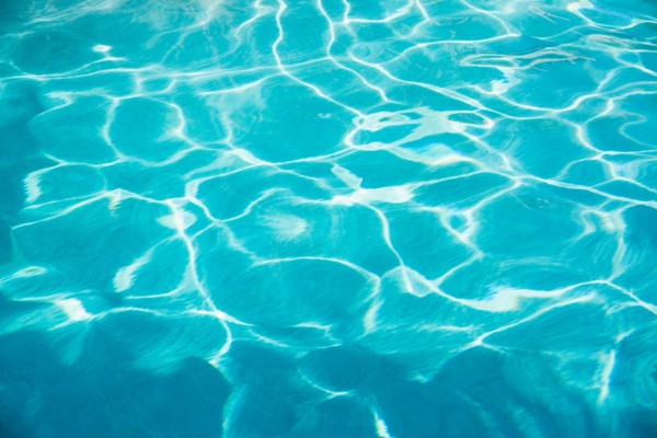 Water in swimming pool.