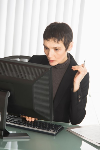 Businesswoman working at desk.