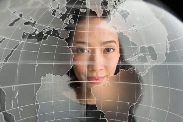 Digital portrait of young woman on world map.