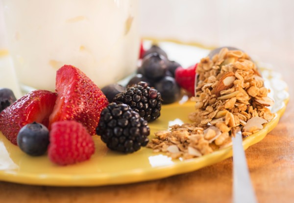Healthy breakfast with fruits, cereal and yoghurt