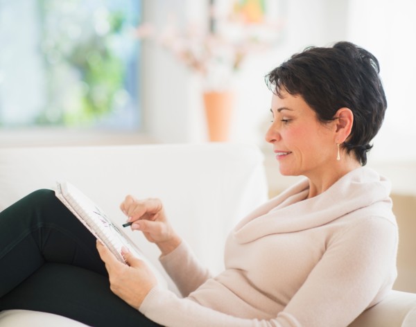 Portrait of mature woman drawing